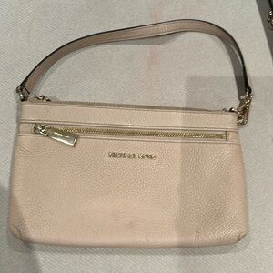 Michael Kors wristlet in pale pink with gold accents